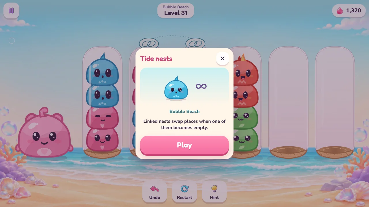 Ventana Tide nests del nivel 31, en inglés: Linked nests swap places when one of them becomes empty, con dos aros unidos por una línea punteada.
