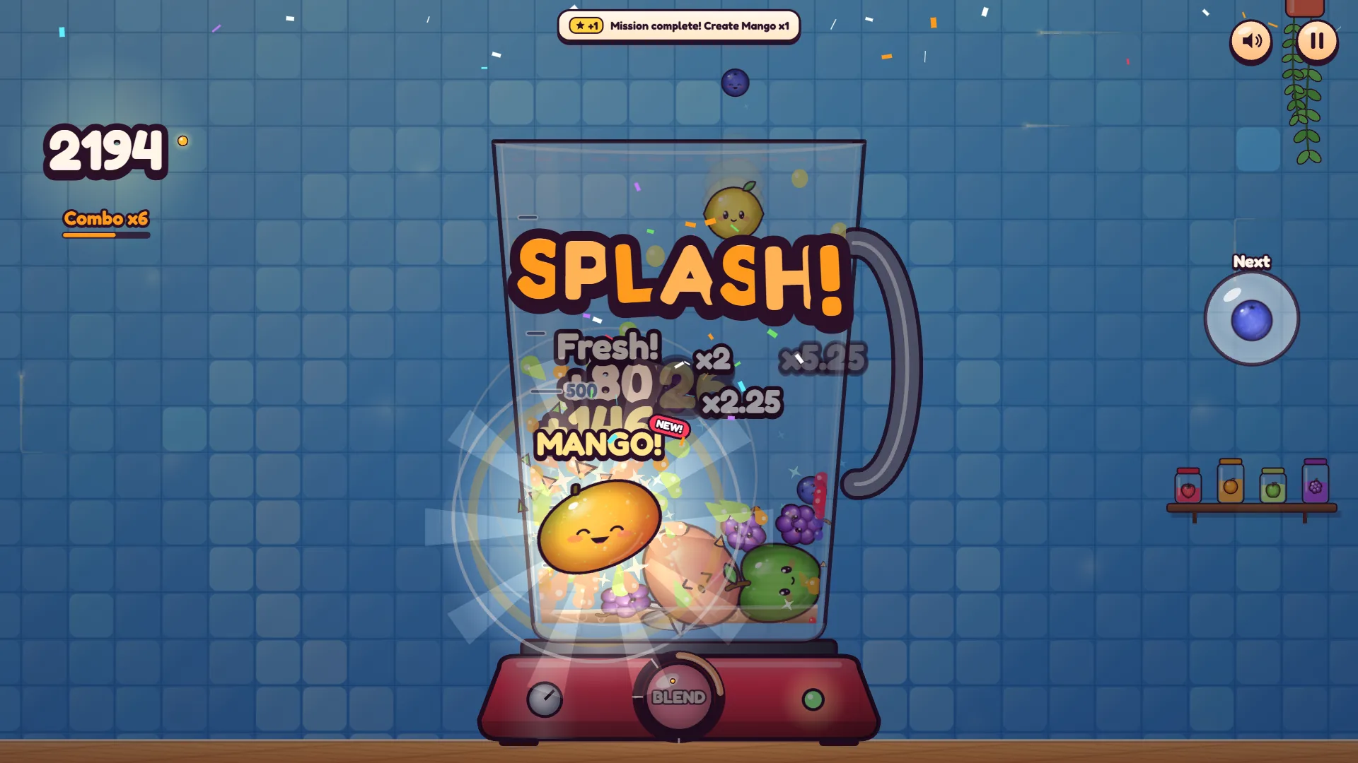 A merge creating a mango in Plop! Fruit Merge, with a mission complete banner at the top of the screen