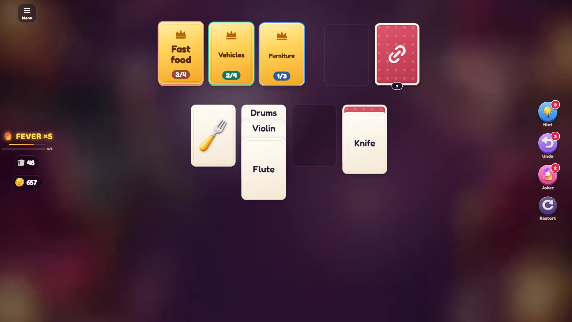Solitaire Links level 3 table with Fast food, Vehicles and Furniture categories at the top, a fork picture card and a Drums, Violin and Flute stack
