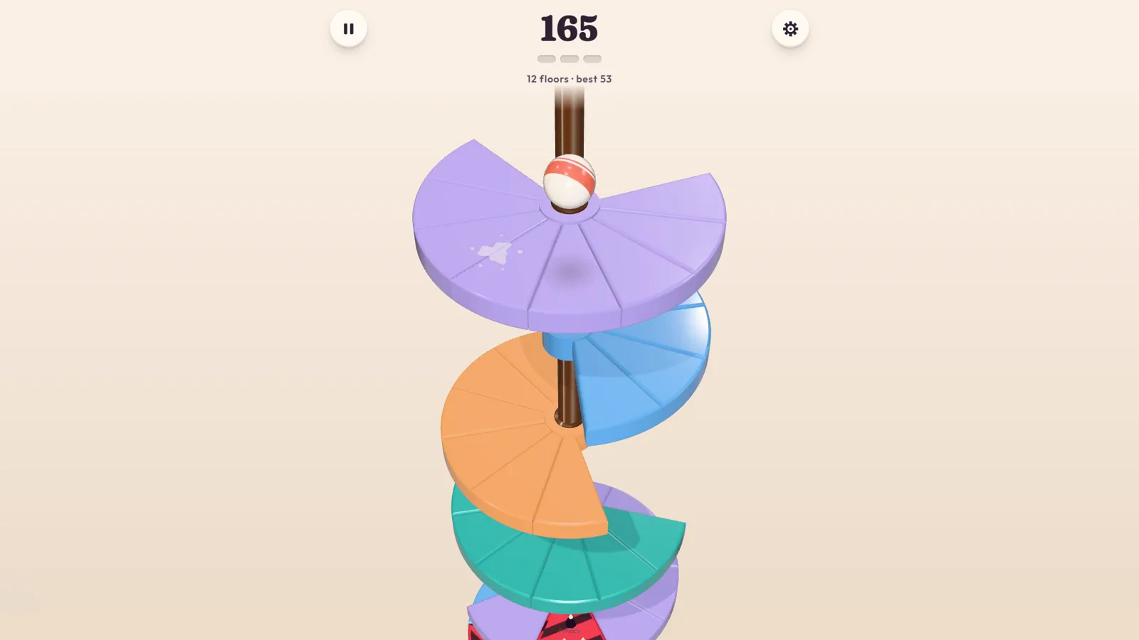 Ball dropping down the colorful Twirldrop tower, with the score at the top of the screen